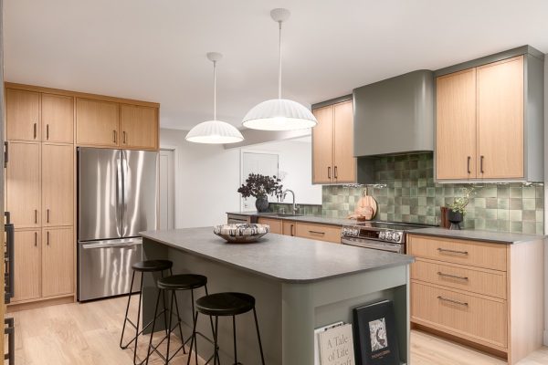 Modern kitchen with island, pendant lights, and wood cabinetry
